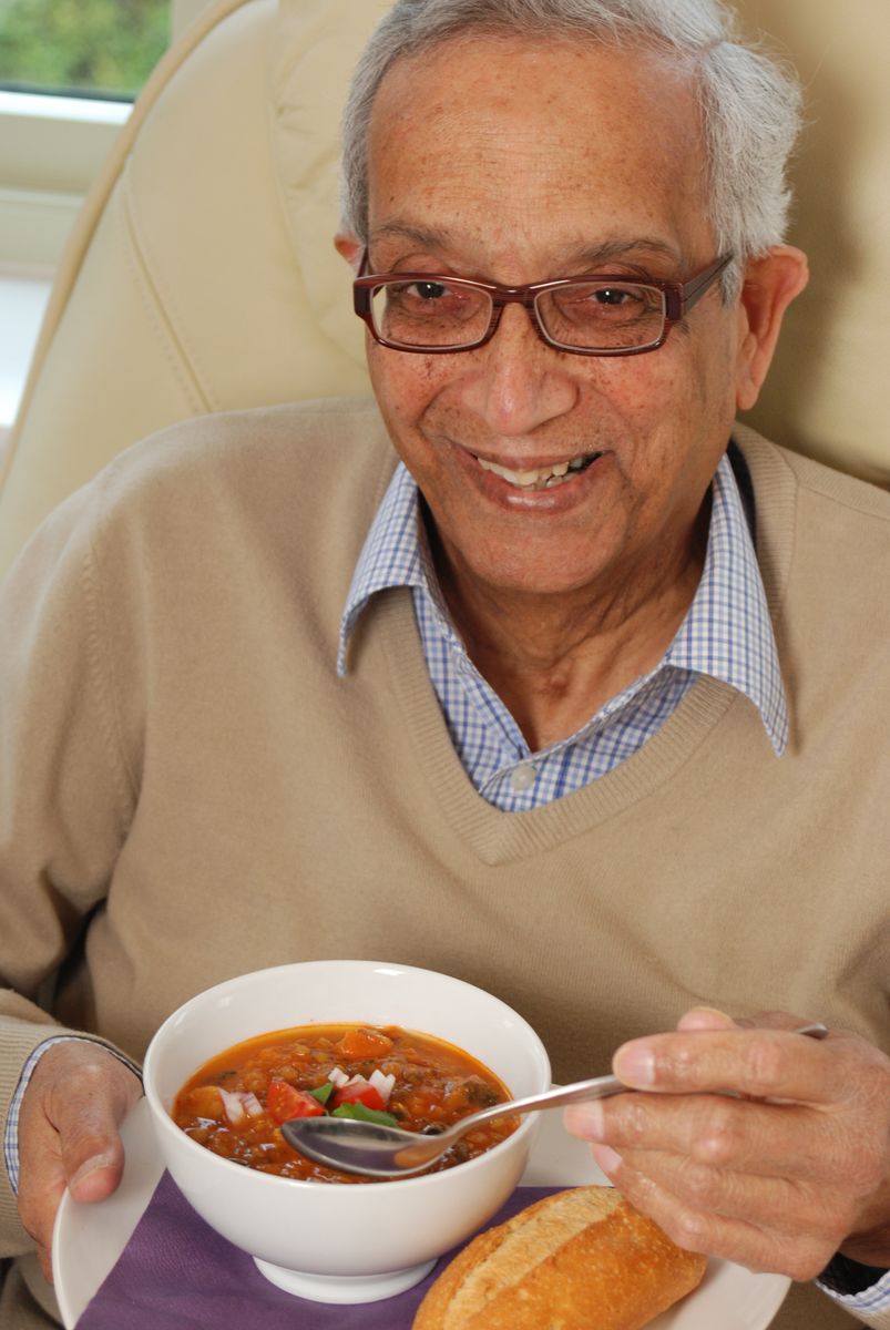 Gentleman eating vegetarian soup