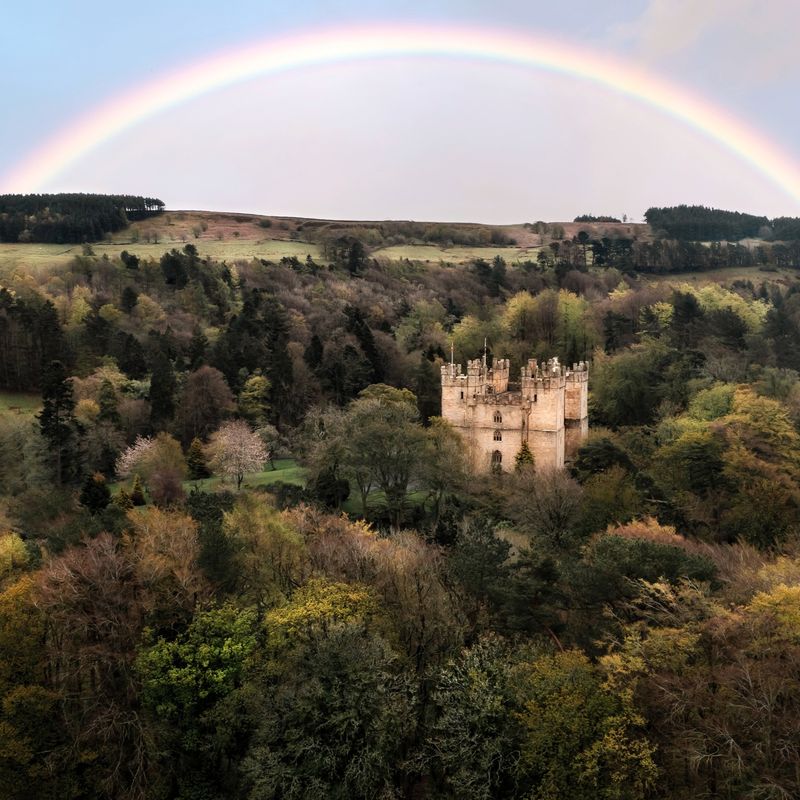 Langley Castle under rainbow in shot taken by drone