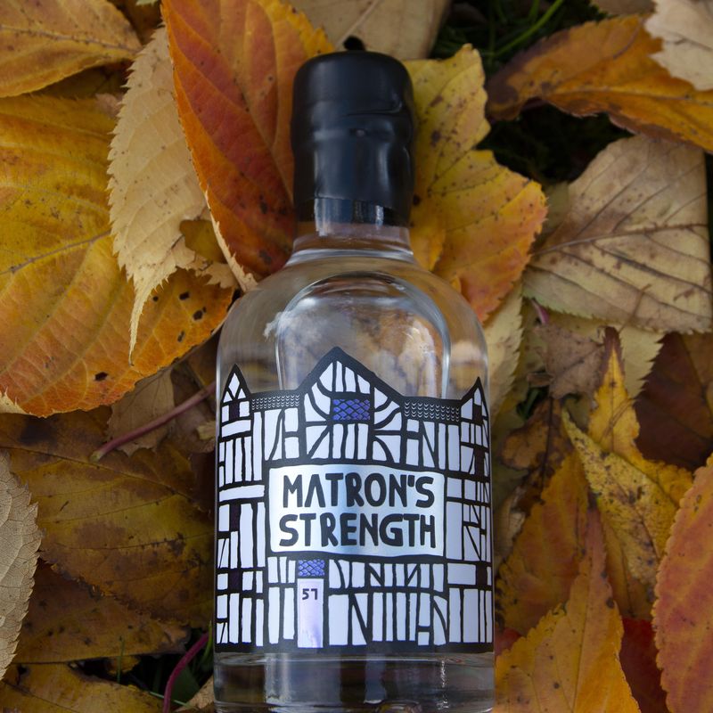 Matron's Strength bottle against leaves