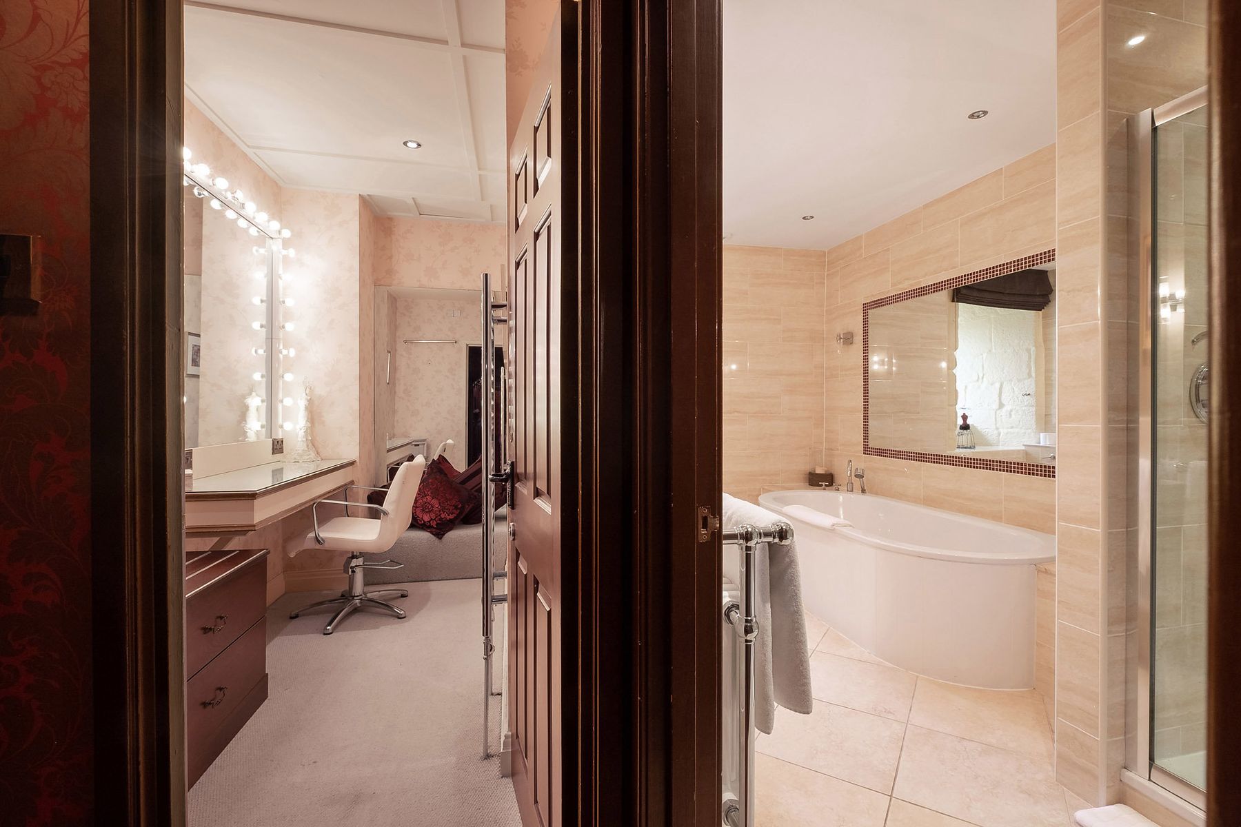 Walk-in dressing room and bathroom at Langley Castle Hotel, Northumberland, UK