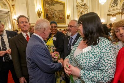 Bryan Baird (centre) meeting HM The King