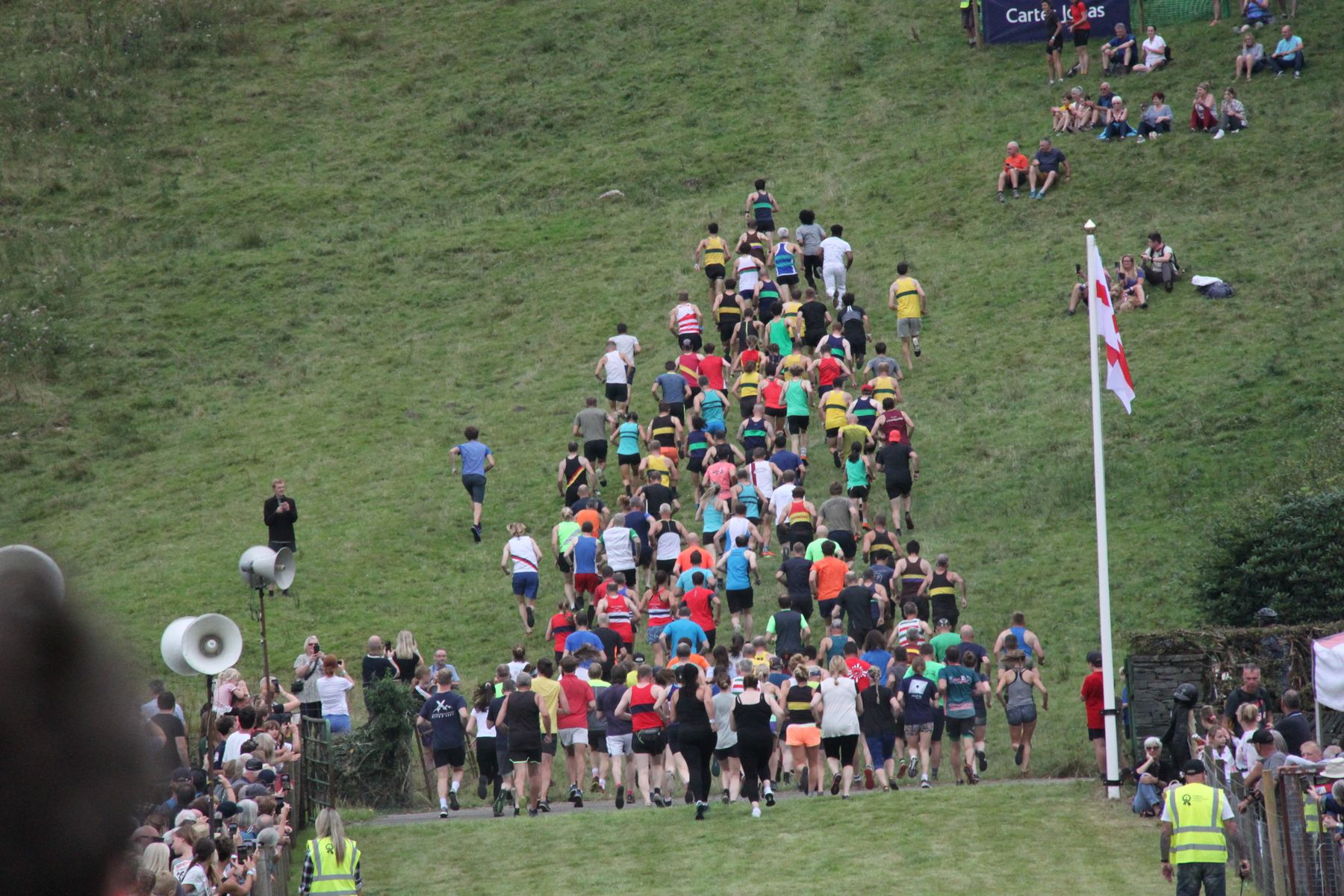 Runners heading up the fell at the start of a fell race at Grasmere Lakeland Sports and Show