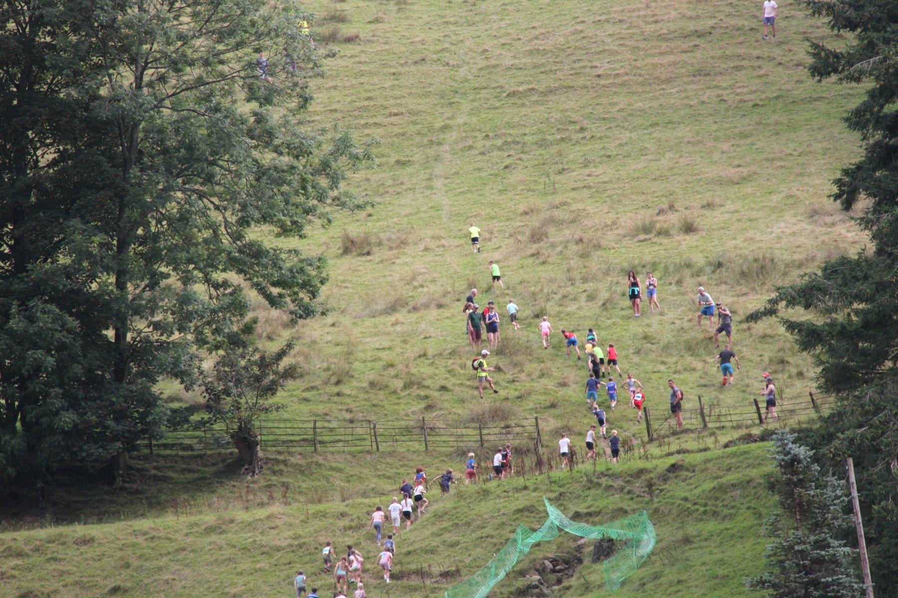 Runners heading up the fell at the start of a fell race at Grasmere Lakeland Sports and Show