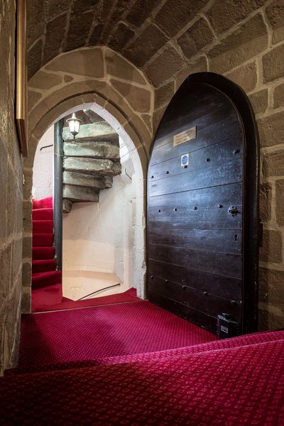 The medieval winding staircase at Langley Castle Hotel, Northumberland, UK