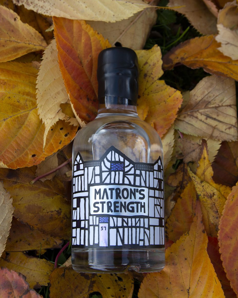 Matron's Strength bottle against leaves