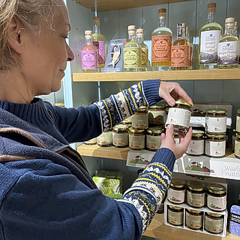 A shopper examines new Morocco Ale Chutney at Levens Hall and Gardens' shop.