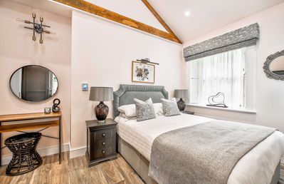 One of the bedrooms at Toll Bar Luxury Villa at Langley Castle, which comes with an en suite bathroom.