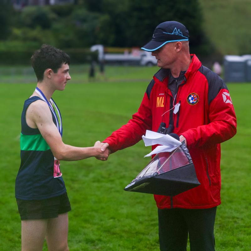 Zeke Sumner being presented with the Pete Bland bursary by Pete's son, Matt Bland