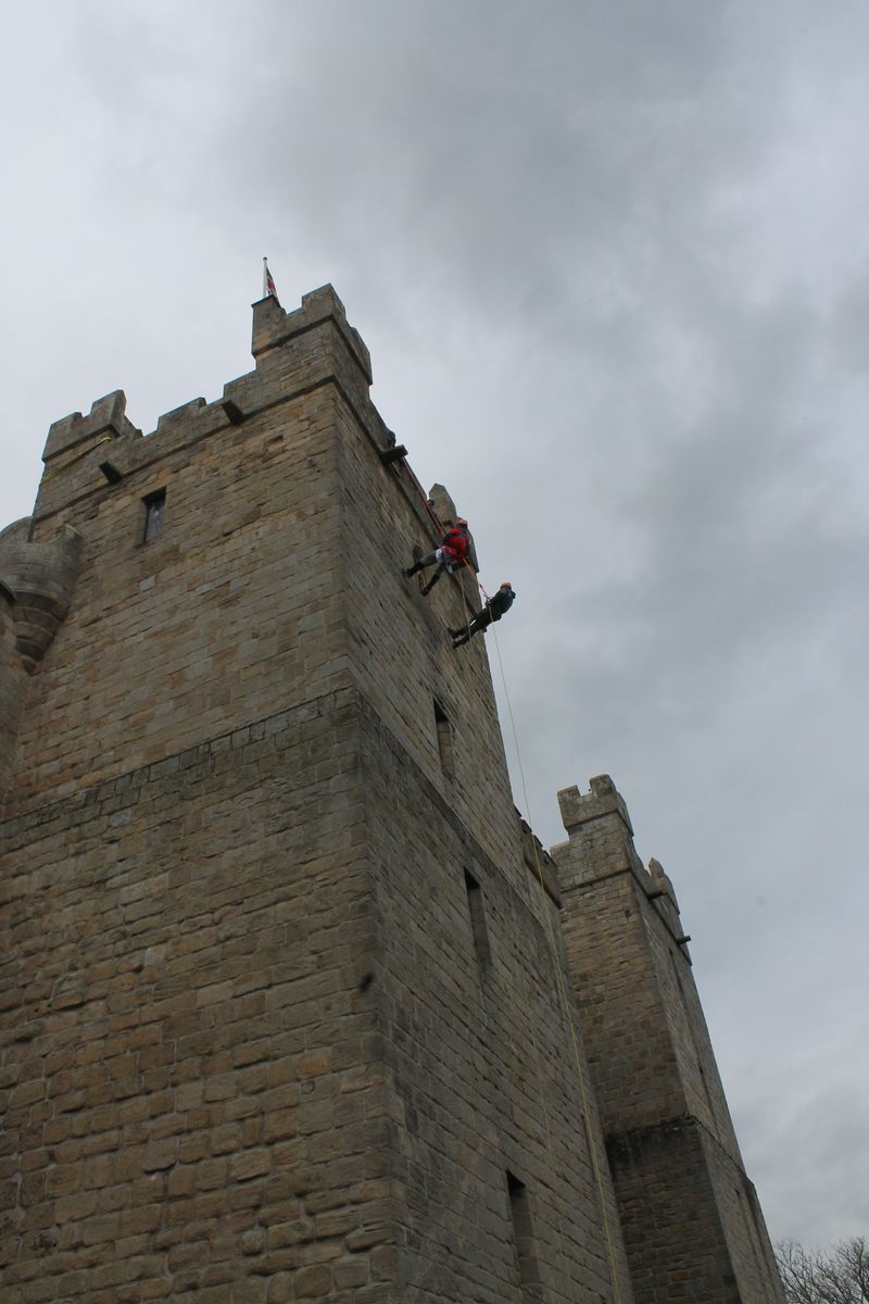 Bold knights scale Langley Castle's walls,