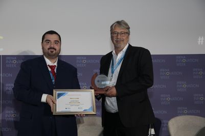 Latent Drive_AFID-IRENA award_Luca Corradi (right)_Dr. Nawal Al-Hosany (left).jpg