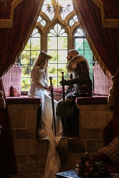 Couple in raised window seat at Langley Castle Hotel