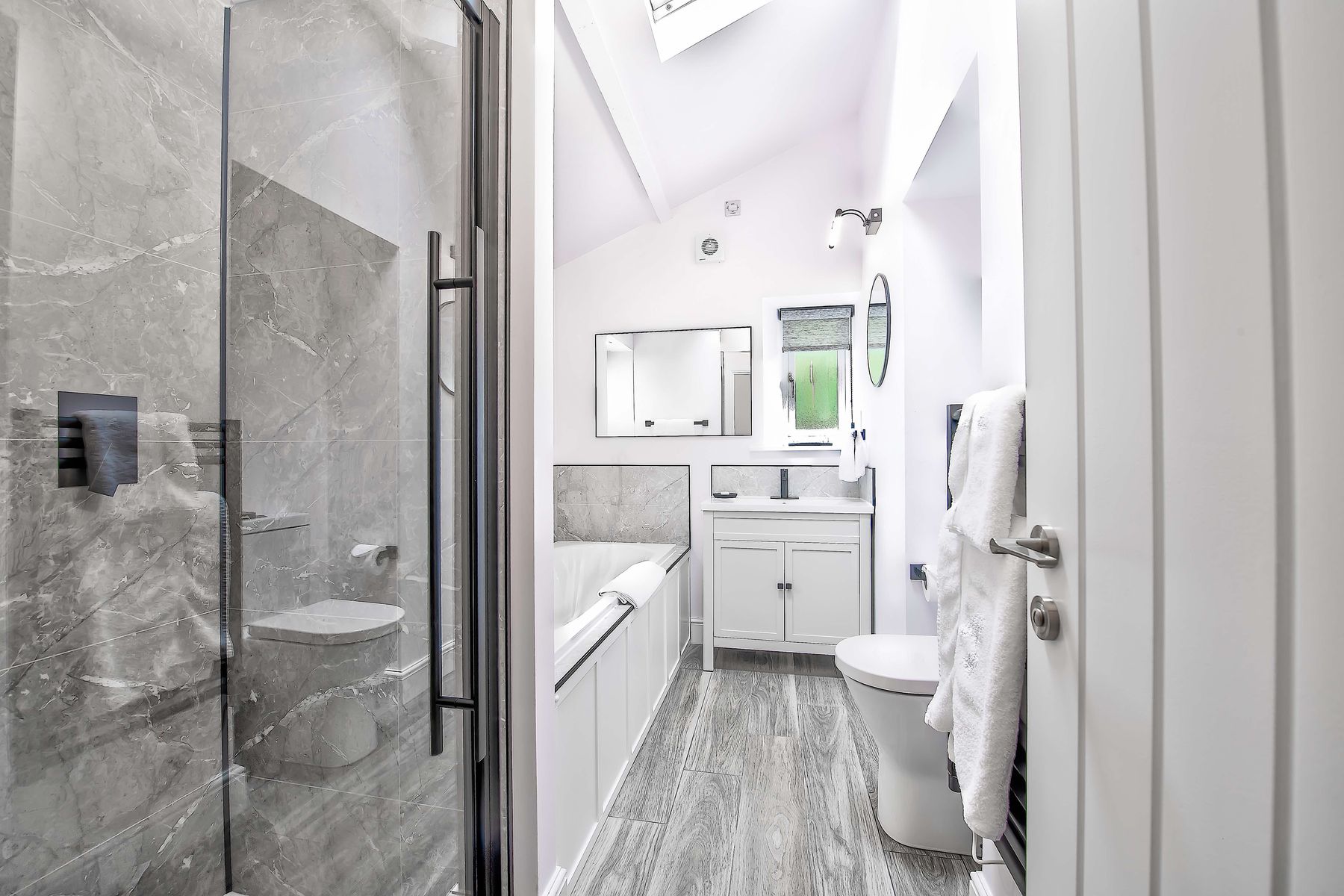 One of the en suite bathrooms at Toll Bar Luxury Villa at Langley Castle, Northumberland, UK