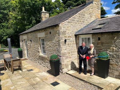 Dr Stuart and Dr Mariann Madnick, Baron and Baroness of Langley, perform the ribbon cutting at Toll Bar Luxury Villa, at Langley Castle, Northumberland, UK