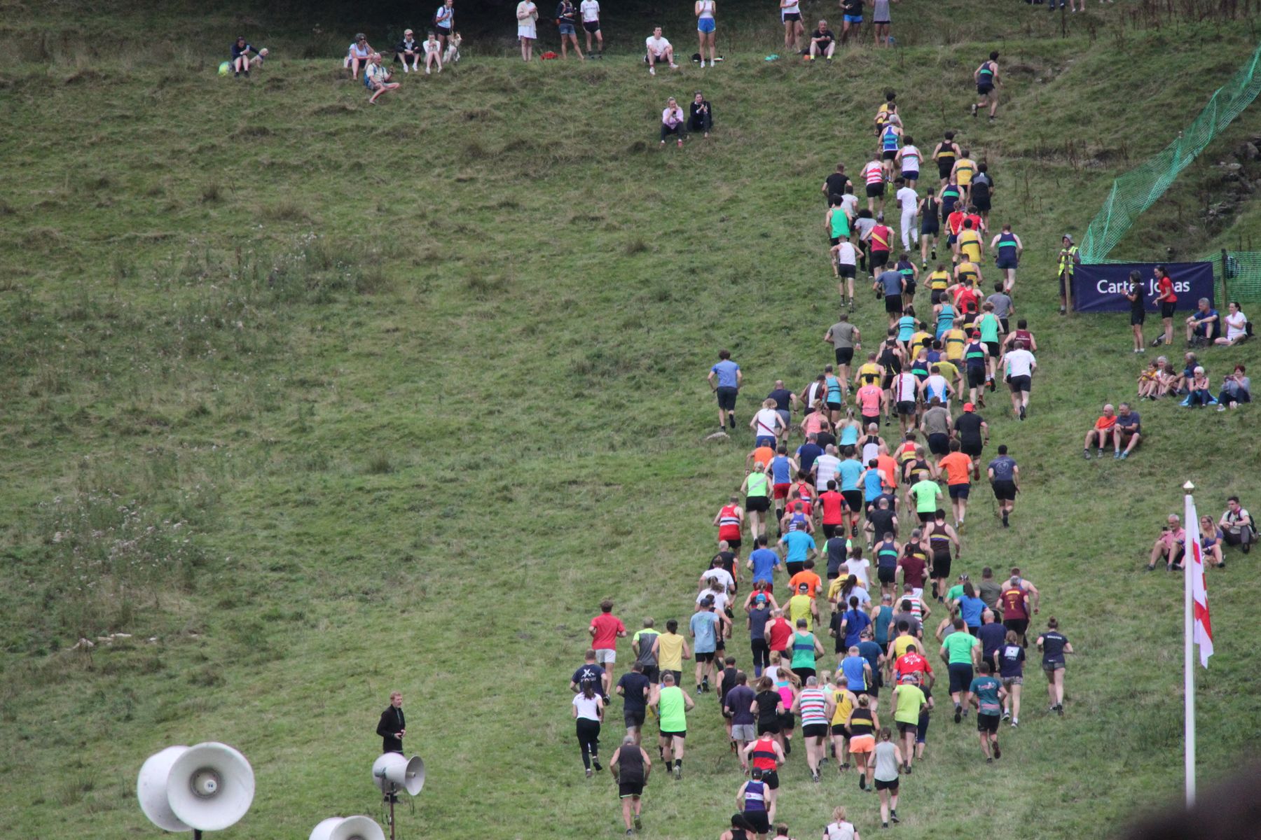 Runners heading up the fell at the start of a fell race at Grasmere Lakeland Sports and Show