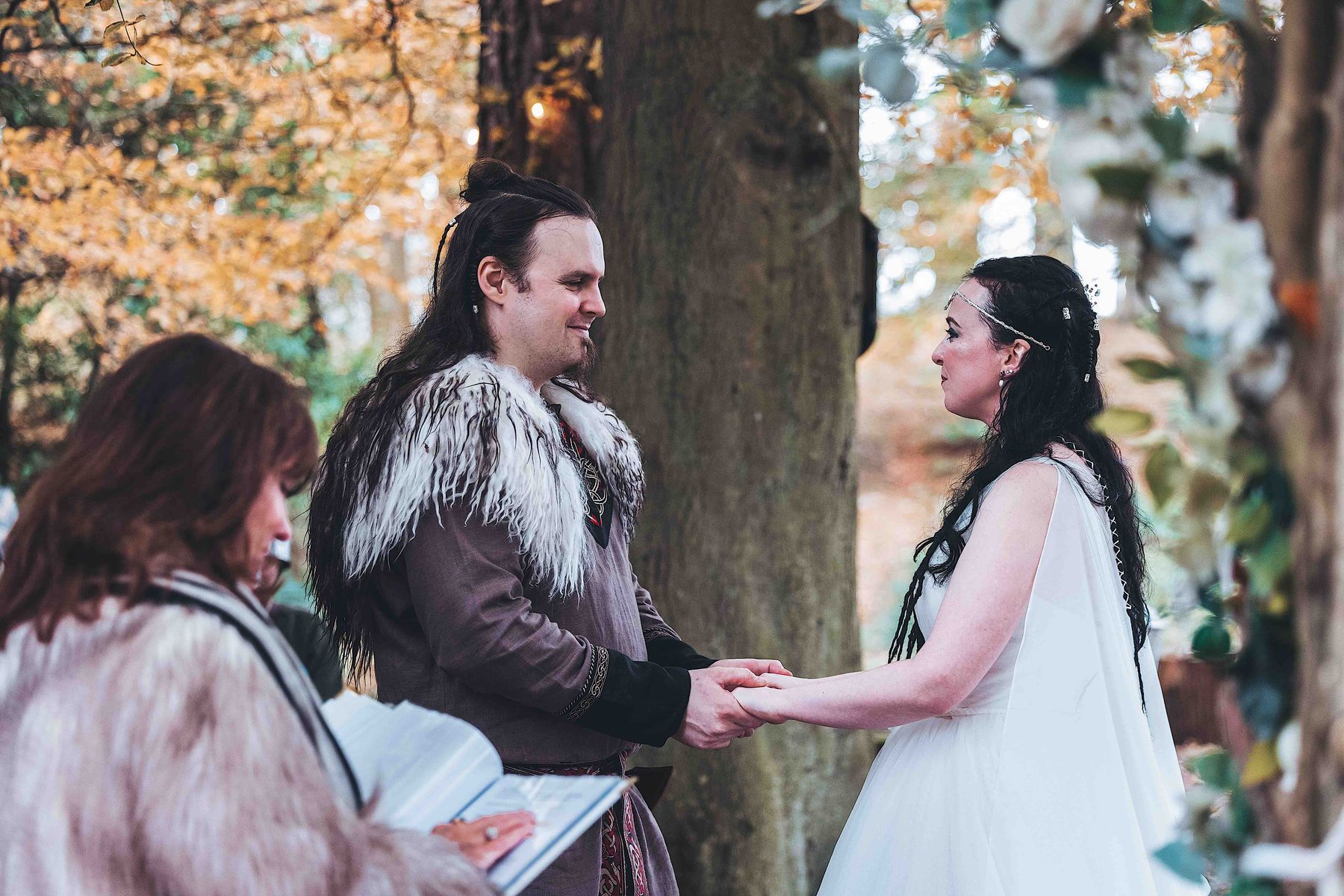 Couple enjoying Viking-themed woodland wedding at Langley Castle, Northumberland