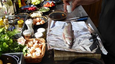 Preparation for an outdoor dining feast using a Valoriani wood-fired oven.