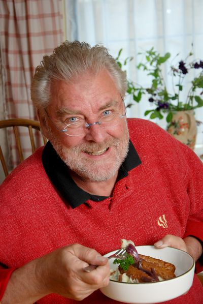 Close up of man eating a vegetarian dinner